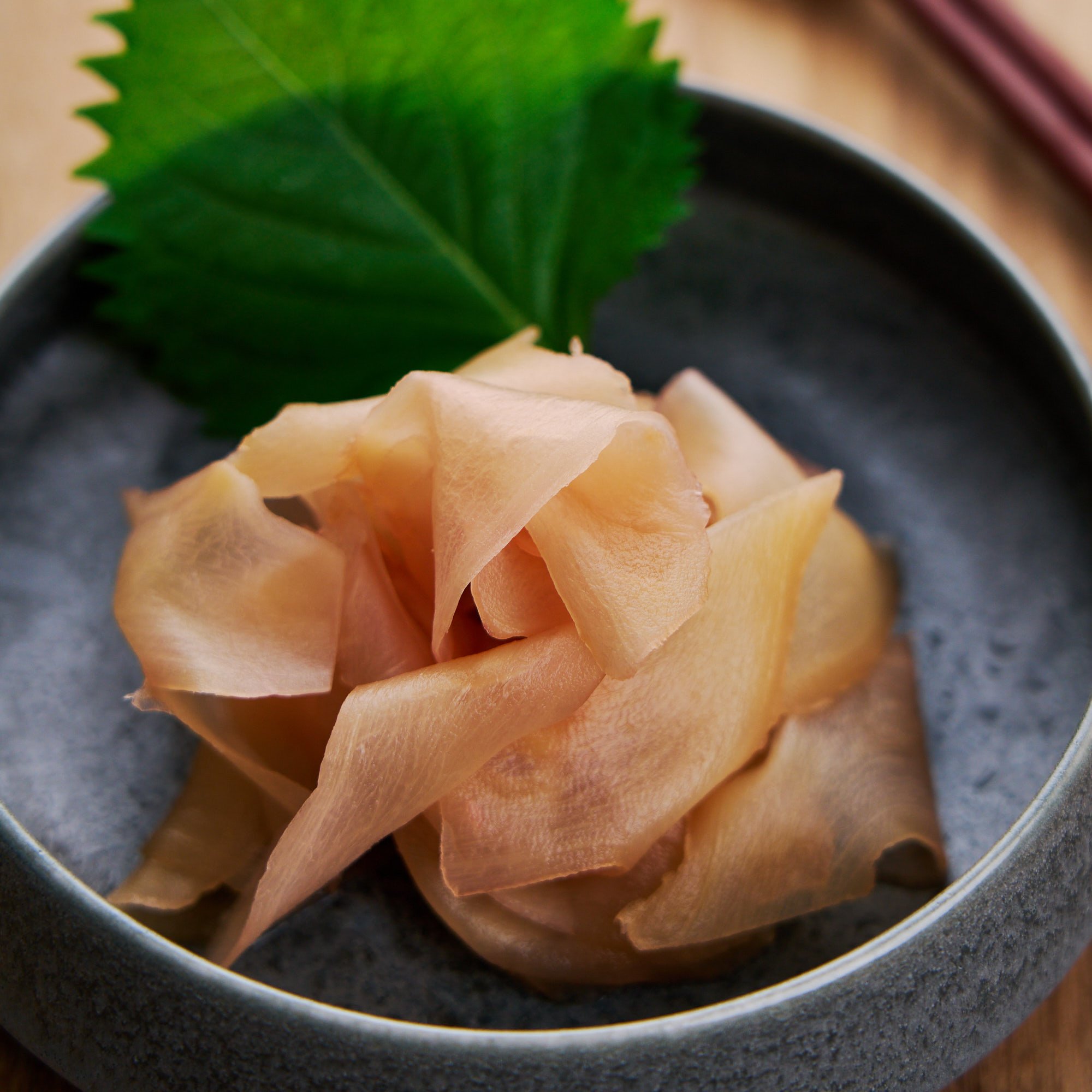 Vibrant plate of sushi with ginger on the side